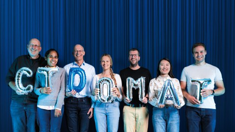 Unveiling the new name ctd.qmat with cluster spokespersons Ralph Claessen (left) and Matthias Vojta (third from left). 