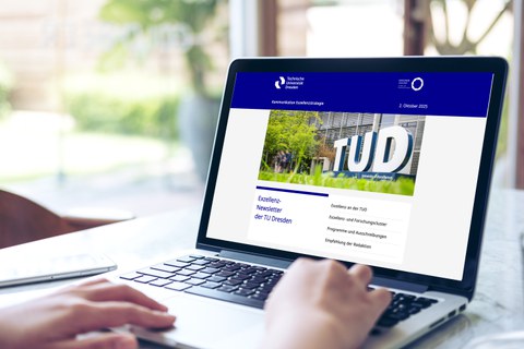 Aufgeklappter Laptop, auf dem Display ist der geöffnete Exzellenz-Newsletter der TUD zu sehen 