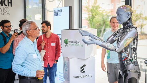 an indian researcher in dialouge with the robot Amica at CeTI